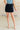 Bentli High Rise Side Tie Denim Skort in Black