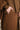 Brown outfit with a focus on the fabric texture.