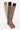 Three pairs of knitted knee-high socks in beige, black, and red on a light background